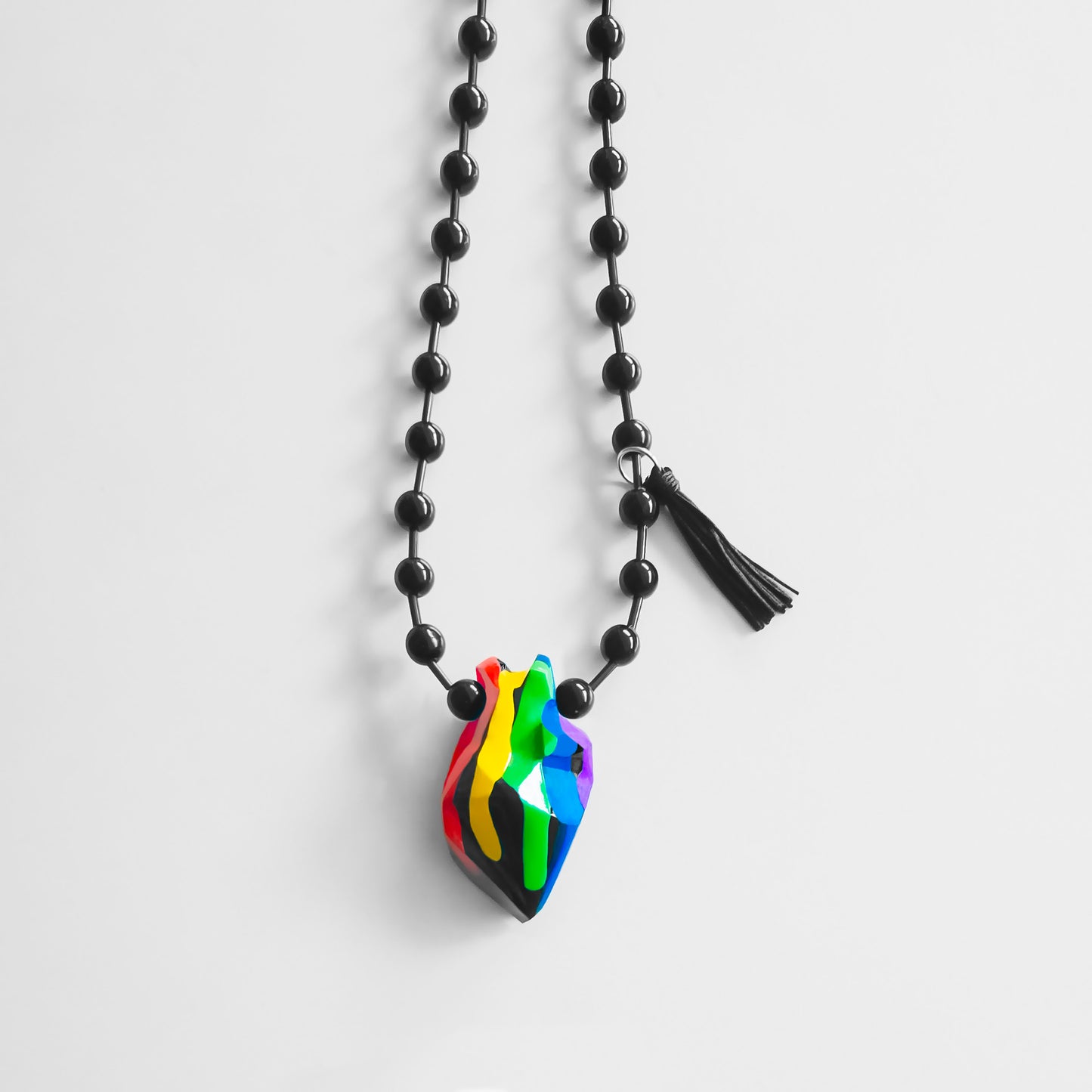 COLLAR ONIX CON CORAZON ARCOIRIS