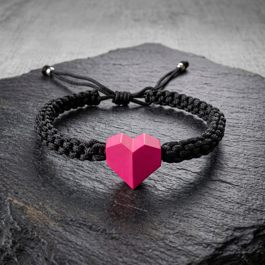 TINY LOVE. PULSERA CON CORAZON ROSA Y CORDON TRENZADO NEGRO