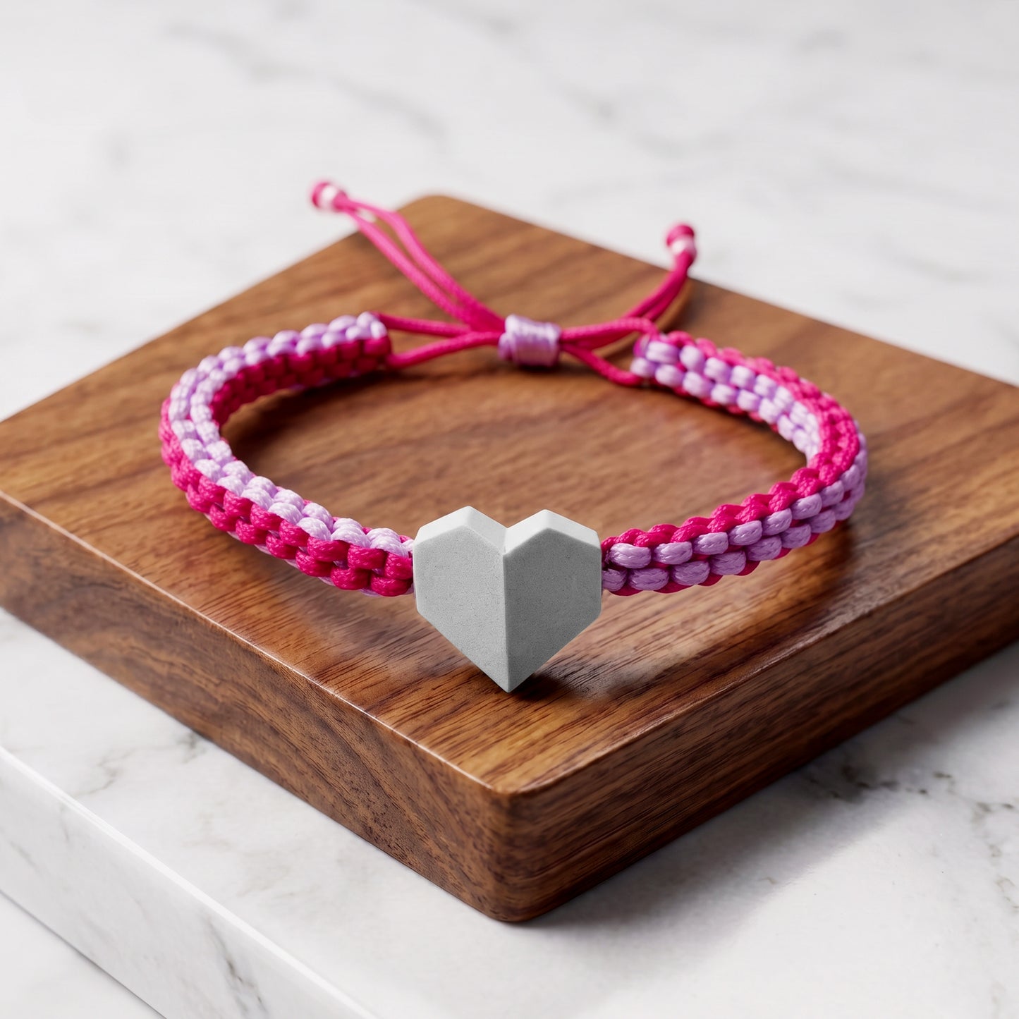 TINY LOVE. PULSERA CON CORAZON Y CORDON TRENZADO LILA  COMBINADO