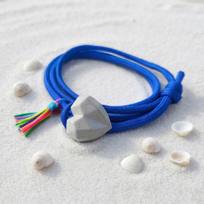 PULSERA CORAZON CONCRETO CORDON AZUL