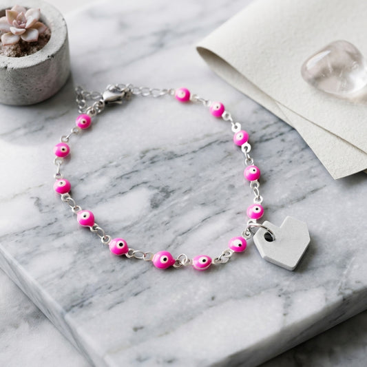 PULSERA CORAZON Y CADENA DE OJOS ROSA